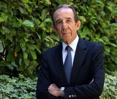 Portrait of an older Latino man wearing a suit