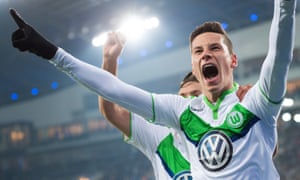 Wolfsburg’s Julian Draxler celebrates after scoring the opening goal of the match.