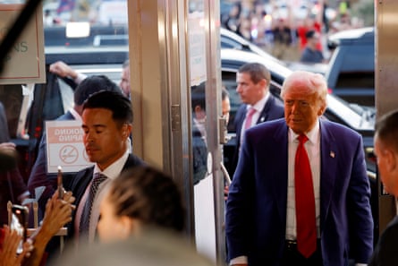 a man in a suit walks into a restaurant