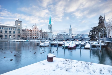 Old Zurich town in winter, view on lake with snow