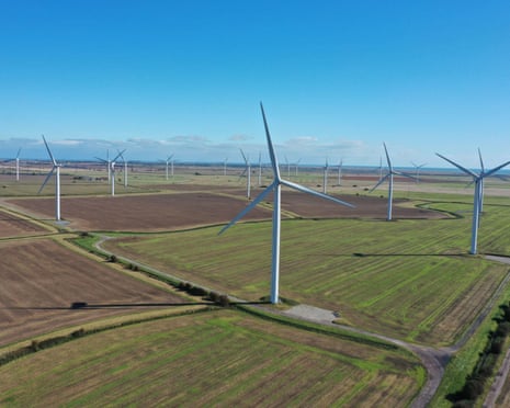 View of wind turbines in a field