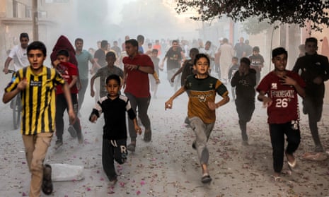 Palestinian children run away as bombardment in Rafah in the southern Gaza Strip continues.