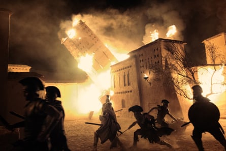 Christopher Nolan’s Odyssey. city in flames being sacked by soldiers in period dress