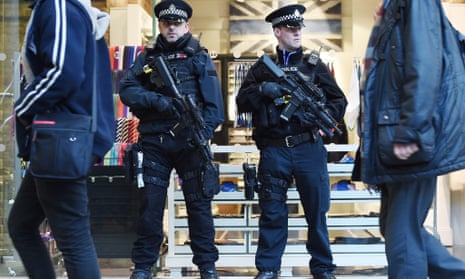 Armed police at St Pancras station in London after the Brussels airport blasts in March 2016.