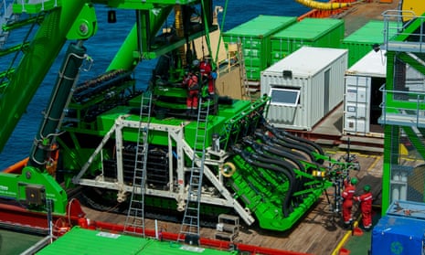 A deep-sea mining robot onboard a ship