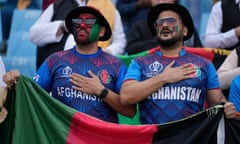Afghanistan supporters sing their national anthem during the World Cup match against the Netherlands in Lucknow, India.
