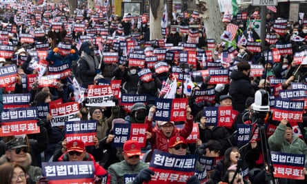 Supporters of Yoon Suk Yeol hold banners reading ‘Nullity of impeachment’