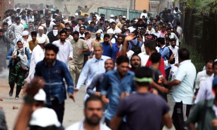 People run during clashes in Anchar last month.