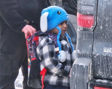 Liam Ramos, 5, being detained by ICE officers after arriving home from preschool on Tuesday with his father.