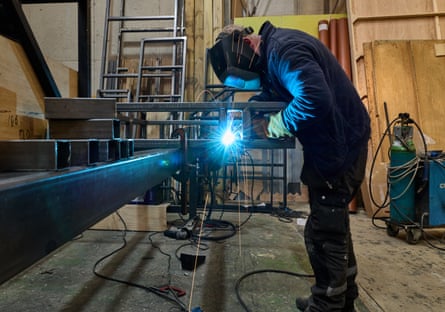 Engineer Tom Breen welds together the truck that will form the base for the bed.