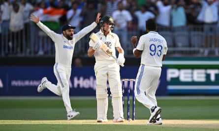 Virat Kohli celebrates while Jasprit Bumrah closes in on Marnus Labuschagne after dismissing him lbw in Australia’s second innings