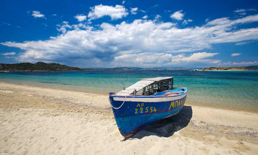Fishing boat pulled up on beach.