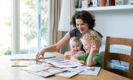 Amelia Hill reading with her children