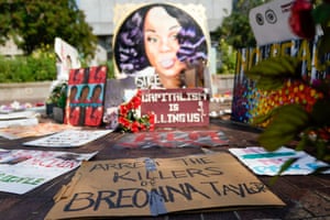 Signs used during protests and rallies are gathered around a memorial for Breonna Taylor in Louisville, Kentucky.