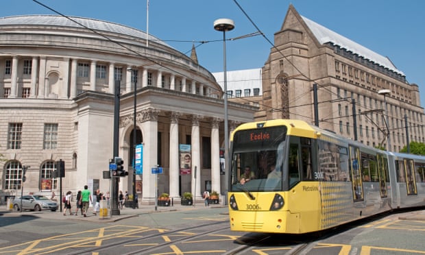 Tram in St Peter’s Square, Manchester, with Central Library and the Town Hall extension in the background