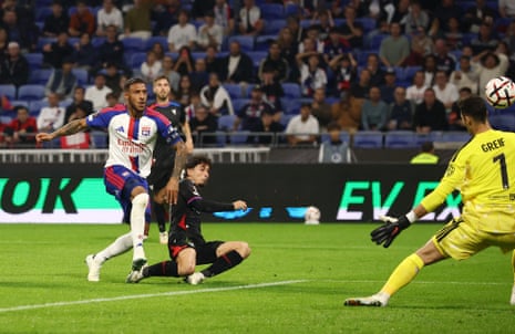 Yeremy Pino shoots past a sliding defender as the goalkeeper dives for the ball