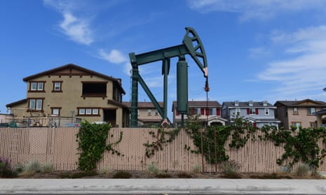 A pumpjack near homes in residential Signal Hill, California.
