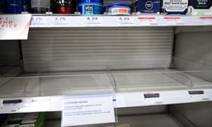 Empty shelf in pharmacy with sign saying hand sanitisers limited to two per customer