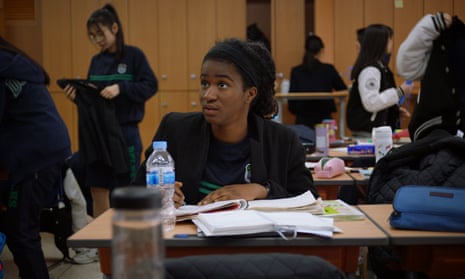 Simone studying at her high school in South Korea.