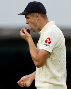 England’s Chris Woakes prepares to polish the ball before passing it to Stuart Broad during last year’s Ashes Test match at Lord’s.