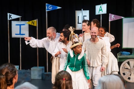 The cast in a dramatic moment from the play.
