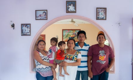 Luis Góngora’s widow stands with their daughter, two sons and grandchildren at their home in Teabo.