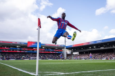 Jean-Philippe Mateta celebrates by kicking the corner flag.