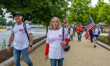 Micki Witthoeft, mother of Ashli Babbitt, stands with supporters as they protest outside the US Capitol on 29 May 2023 in Washington DC.