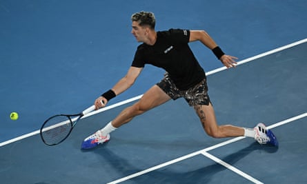 Thanasi Kokkinakis hits a return during his defeat by Andy Murray.