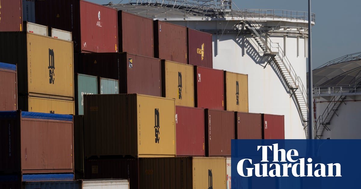 Two men charged after police find $60m worth of cocaine in shipping container in Sydney