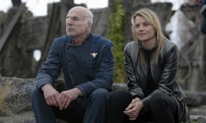 Michael Hogan anad Lucy Lawless in the Battlestar Galactica TV series.