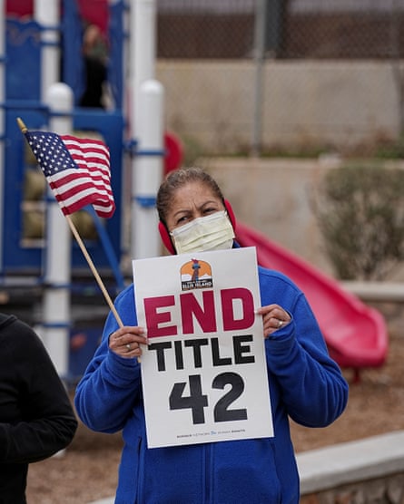 A women in Texas protests against Title 42 during a march in solidarity with migrants coming to the border.