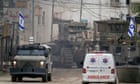 Israeli forces surround Palestinian hospital and refugee camp in West Bank