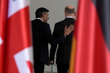 Rishi Sunak (left) and German chancellor Olaf Scholz leaving their press conference earlier.
