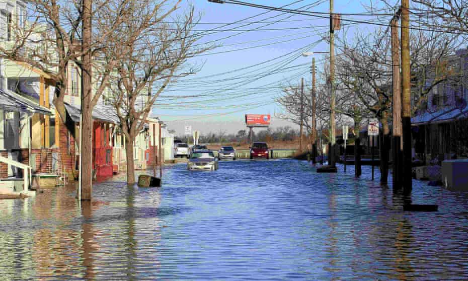 Arizona Avenue is seen underwater following coastal flooding in Atlantic City, New Jersey, on 24 January 2016. More than 13 million Americans are at risk with a 6ft (1.8 meter) rise in sea level, scientists say.