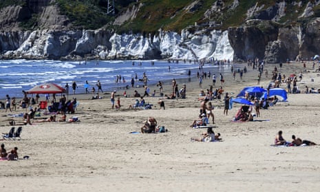 People gather in Pismo Beach, California, on 25 April. 