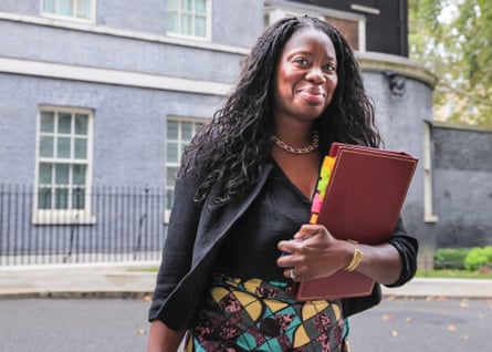 Miatta Fahnbulleh carries a red folder, arriving for a cabinet meeting