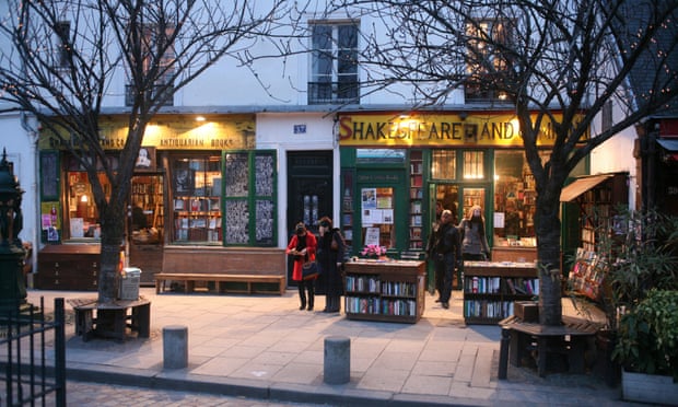 Customers outside the Shakespeare and Company bookshop, Paris, France. for Saturday Review.