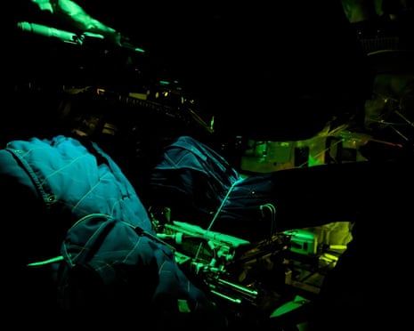 The crew’s sleeping bags are illuminated inside the Orion spacecraft.