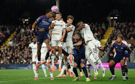 Arsenal's Jurrien Timber goes up for a header with Fulham's Timothy Castagne.