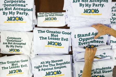 A Green party volunteer folds Jill Stein shirts as people arrive for the convention at the University of Houston.