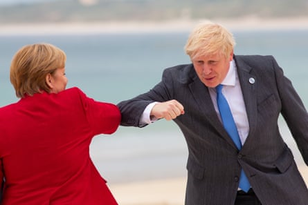 Boris Johnson greets German chancellor Angela Merkel with an elbow bump.