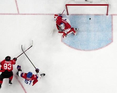 Mitch Marner of Canada scores their fourth goal in overtime to win the men’s ice hockey quarter-final match against the Czech Republic at the 2026 Winter Olympics