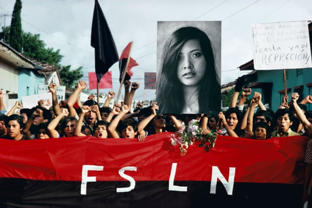 Protesters in Nicaragua in 1978 hold up a large photograph of Arlen Siu, a singer and Sandinista who had been killed by the National Guard three years earlier