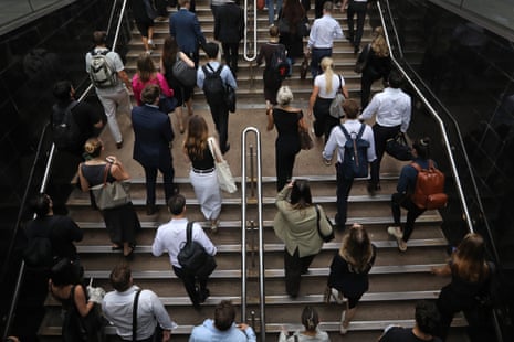 Pedestrians exit Martin Place train station in Sydney, Australia.