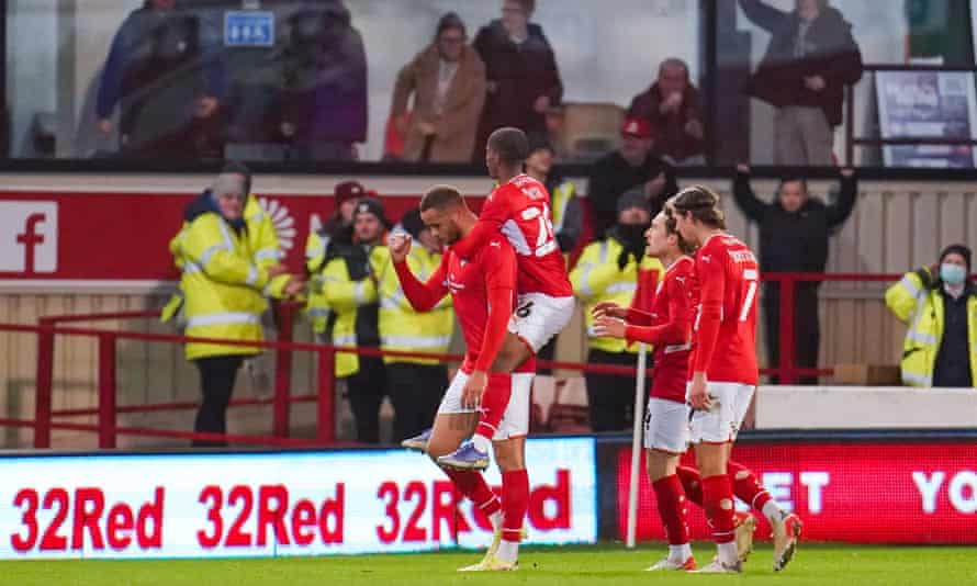 Barnsley forward Carlton Morris (left) celebrates with team-mates after scoring their fifth goal.