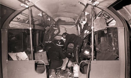 Firemen working inside the wreckage