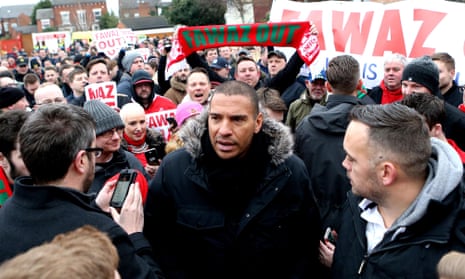 The former Nottingham Forest striker Stan Collymore was among fans protesting against the club’s owner, Fawaz Al Hasawi, ahead of their game against Bristol City.