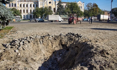 Debris of an S-300 missile with Russian writing is collected next to a crater after being shut down over Kharkiv, Ukraine. Kharkiv and surrounding areas have been the target of heavy shelling since February 2022.