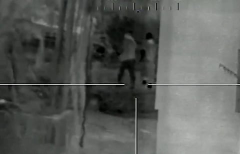 Black and white image of a figure in the crosshairs